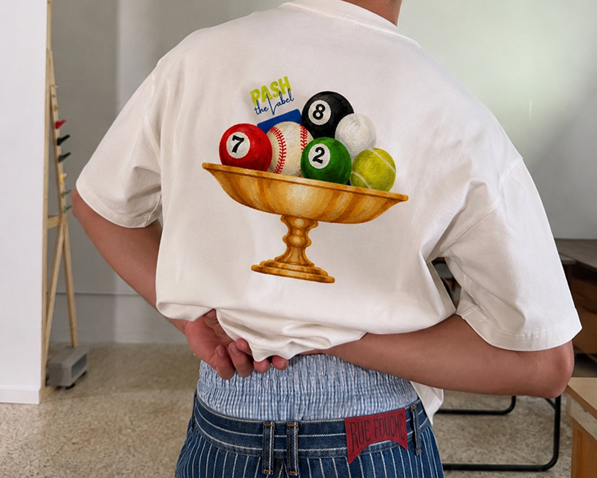 Back view of a person wearing a white t-shirt printed with a trophy bowl of pool balls